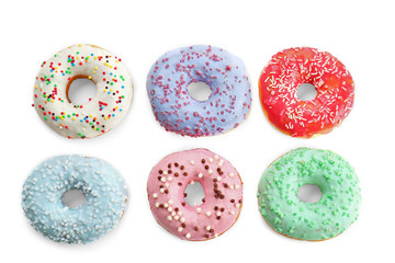 Fototapeta na wymiar Delicious donuts on white background