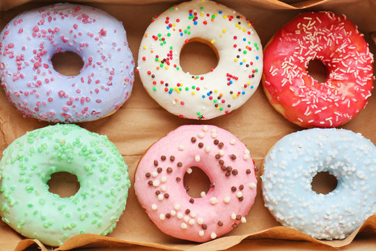 Delicious donuts in box, closeup