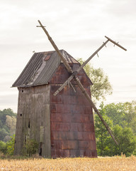 Kawnice, Poland. Old ruined windmill on the field.
