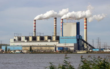 Konin, Poland. Working power station, smoking chimneys. - 131962556
