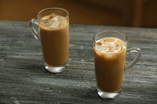 Glasses of cold coffee on table