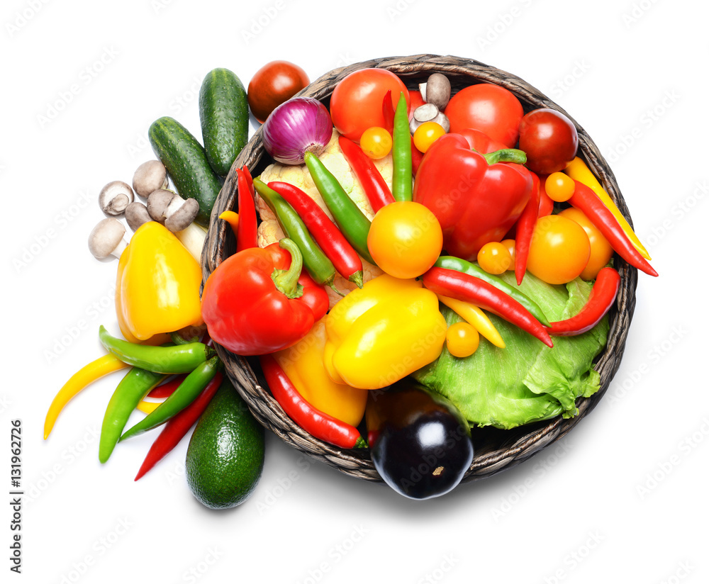 Poster group of fresh vegetables in basket on white background