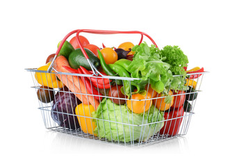 Group of fresh vegetables in basket on white background