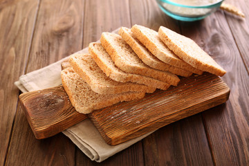 Sliced bread on wooden background