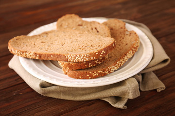 Sliced bread on wooden background