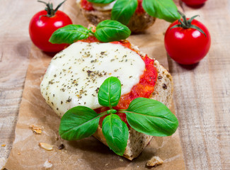 Italian bruschetta with cherry tomatoes, mozzarella & fresh basil.
