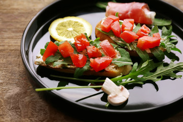 Delicious bruschetta on tray