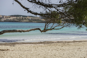 Rocks by the sea with waves of the Mediterranean sea next to the