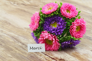 Merci (thank you in French) card with colorful bouquet of flowers
