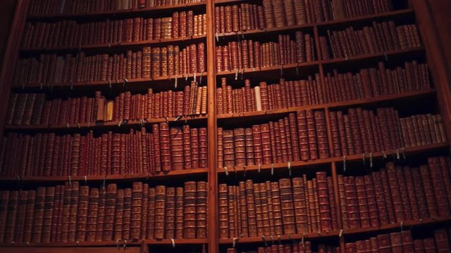 Big collection of old uncognizable books. 4K pan shot