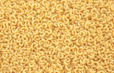 Top down view of uncooked macaroni.
