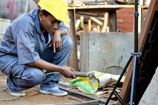 Young Woman Welder At Work.