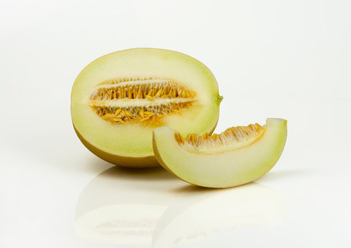 Yellow melon sliced on white background