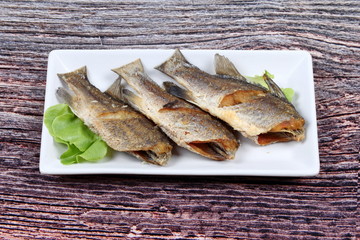 Deep fried small snapper with bean sauce.