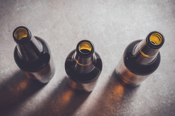 Beer bottles on dark table