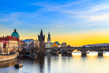 View of the Vltava River and Charles bridge shined with the sunset sun, Prague, the Czech Republic