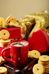 Coffee Cup with cookies with hearts out of the jam.