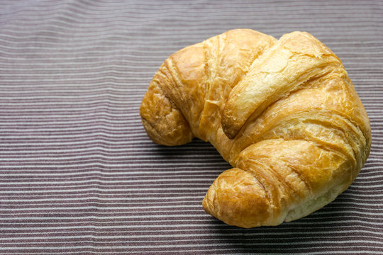 croissant on woonden plate