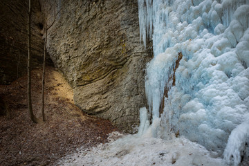 Frozen waterfall in cold winter