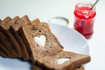 photo love bread. bread valentine. photo love delicious slice of bread with strawberry jam sweetener. is suitable for decorating the nuances of affection