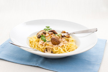 Spaghetti carbonara with brown mushroom