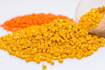 Polymeric dye for plastics. Pigment in the granules on a light background. 