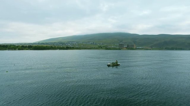 Fishermen on the mountain lake Sevan in Armenia