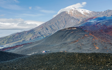The cone of the Ostry Tolbachik volcano on the background of blue sky - Kamchatka, Russia
