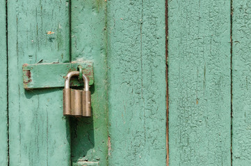 green door with padlock