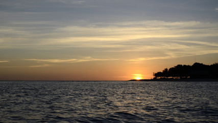 Fototapeta na wymiar Beach sand sea sky sun sunset nature background landscape.