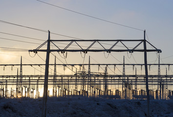 Electric power plant during sunset. Silhouette image.