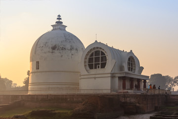 Parinirvana Stupa and temple in foggy morning, Kushinagar, India