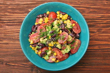 Black bean salad with avocado, corn and tomato. healthy food concept