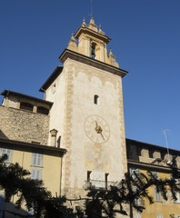 Fototapeta na wymiar Bergamo - Old city (Citta Alta). One of the beautiful city in Italy. Lombardia. The clock tower close to Roncalli historical building during a wonderful blue sky.
