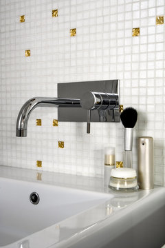 foreground of faucet in the modern bathroom