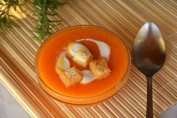 Pumpkin Creme Soup On A Bowl With Heavy Cream. Organic Vegetarian Food.