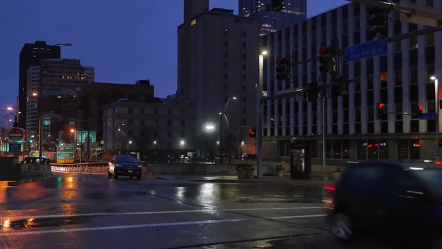 PITTSBURGH - Circa December, 2016 - An evening or nighttime establishing shot of traffic in downtown Pittsburgh.  	