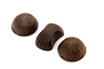 Chocolate candies isolated on white background.
