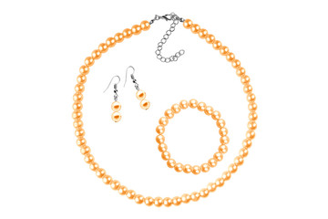 Fashion set of a necklace, a bracelet and a pair of earrings made of medium-sized round beads like pearls, isolated on white background, clipping path included