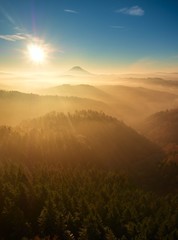 Obraz na płótnie Canvas Fall daybreak. Misty awakening in beautiful hills. Peaks of hills