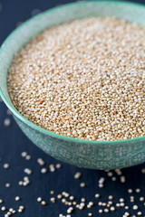 white quinoa on dark background