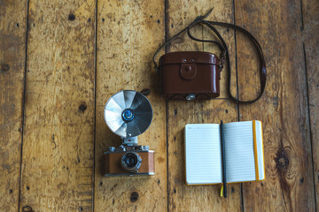 Vintage camera with bag and notepad