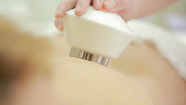Hardware cosmetology. woman getting rf lifting procedure in a beauty parlour.