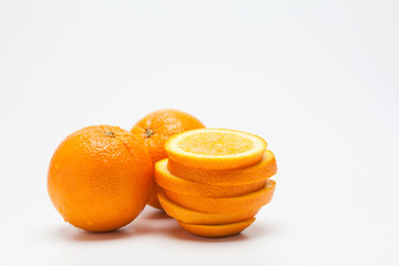 Sliced oranges on a white