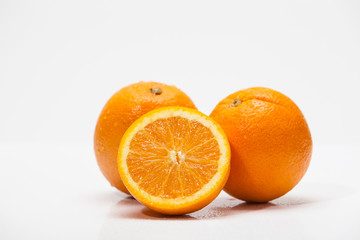 Half of oranges on white background