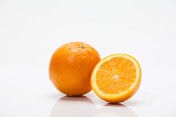 Half of oranges on white background