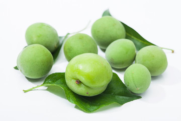 Green plum korean fruits with leaves