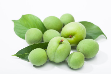 Green plum korean fruits with leaves 