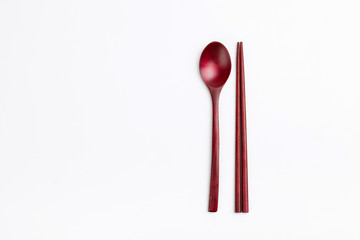 Wood spoon and chopsticks on white background 