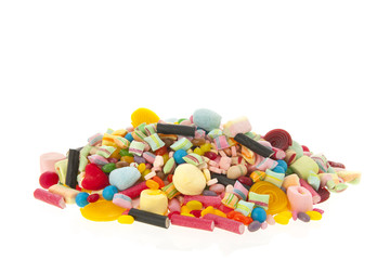 Mixed colorful candy on white background